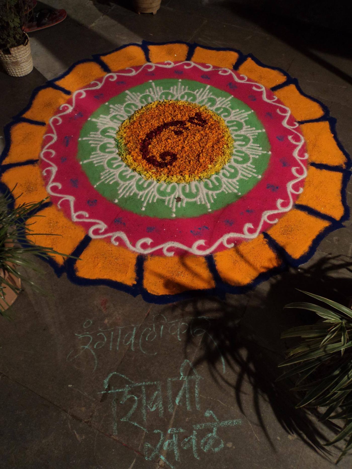 Marigold petal rangoli in orange and maroon