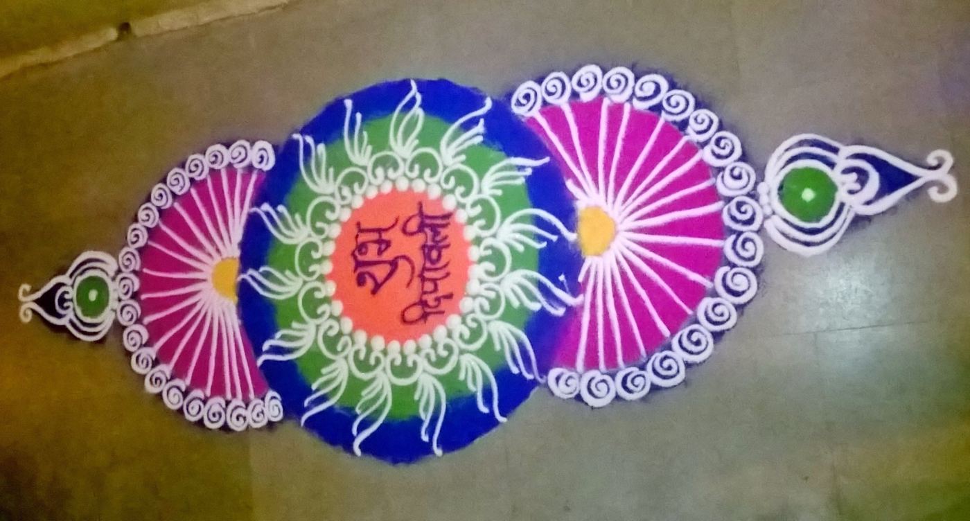 Multicoloured peacock feather rangoli