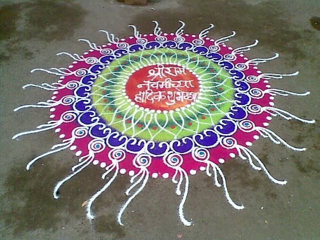 Blue and red mandala rangoli with lotus centre